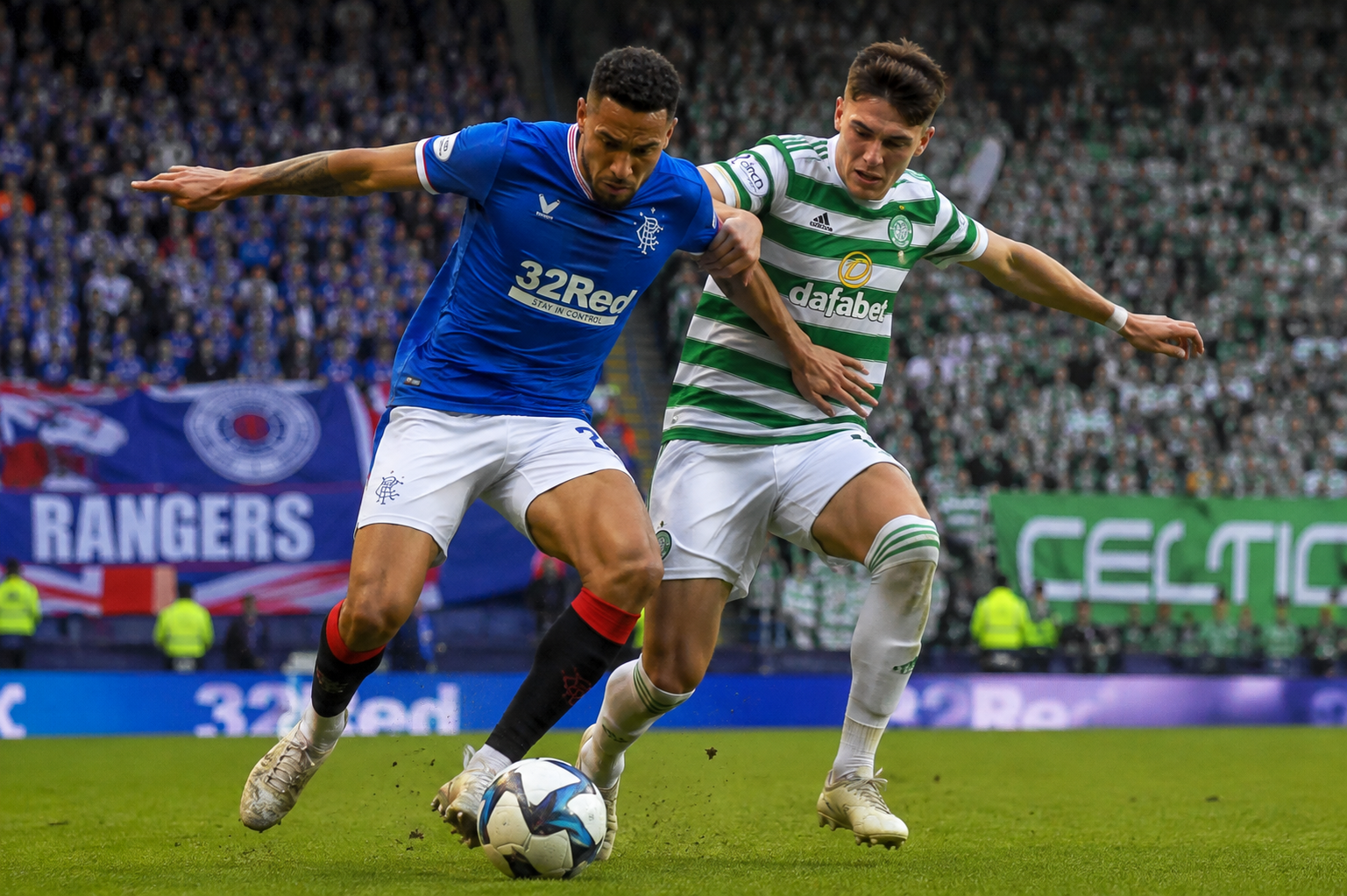 Rangers vs Celtic players battling for the ball during an Old Firm derby